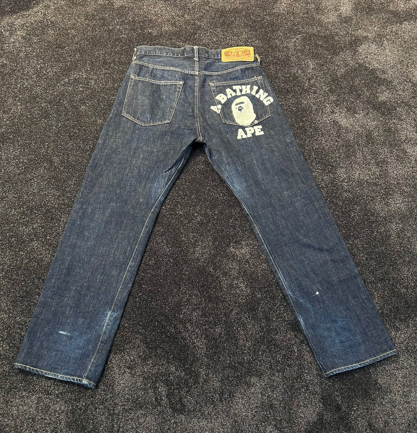 A Bathing Ape White Back College Logo Jeans