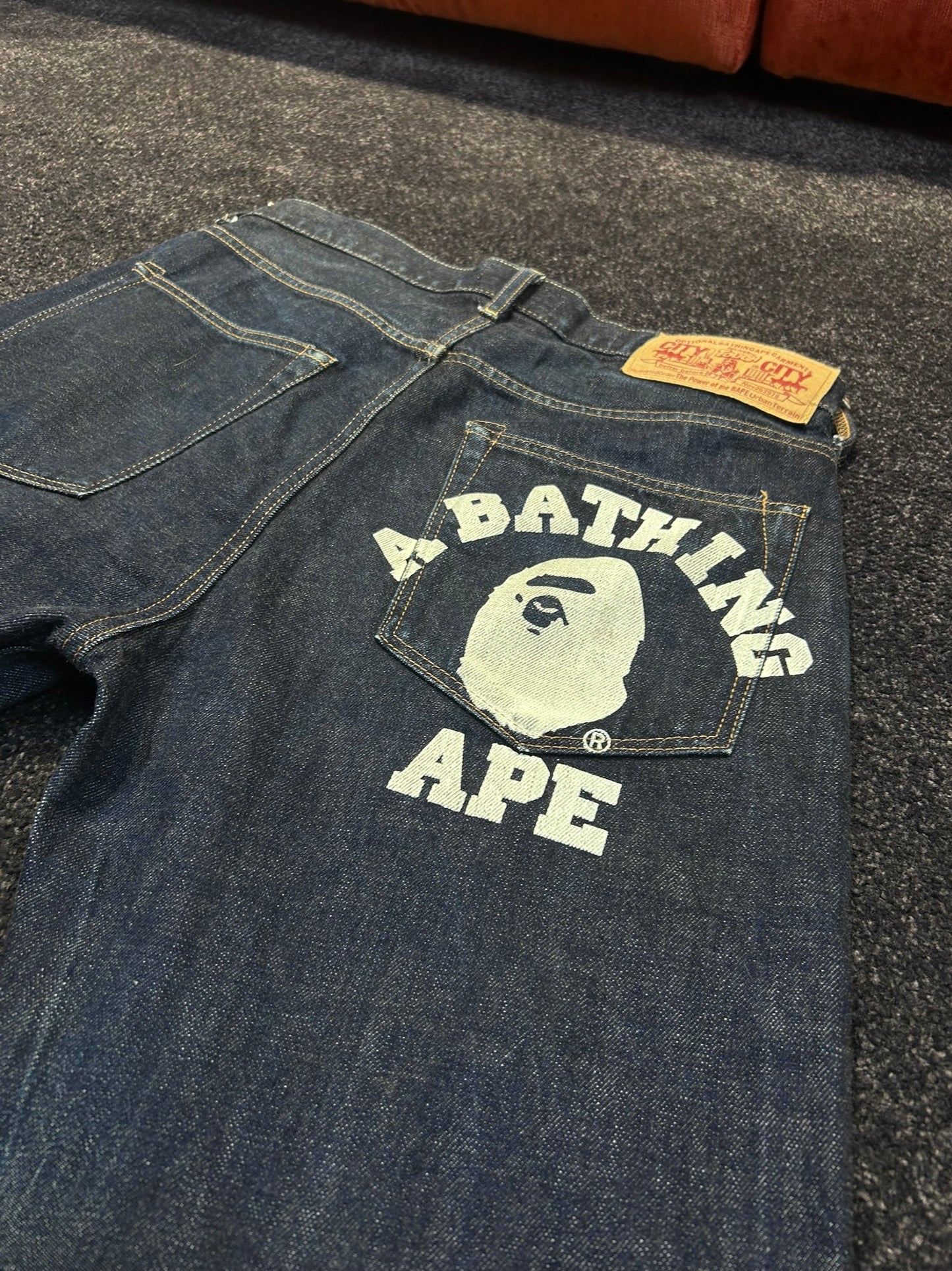 A Bathing Ape White Back College Logo Jeans